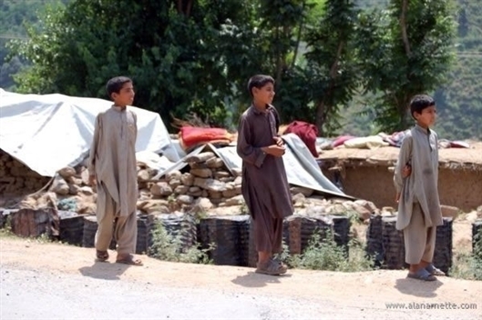 Family of 10 living under a tarp in the ruins of their home